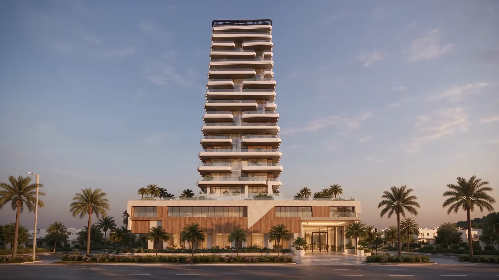 A tall white residential tower with curved balconies on every floor, above a stone and timber podium with palm trees at sunset
